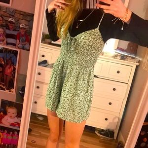 Light green romper with white little flowers.